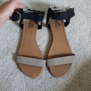 Tan and black sandals